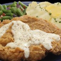 Chicken Fried Chicken · Hand breaded and fried boneless chicken breast topped with country cream gravy. Comes with s...