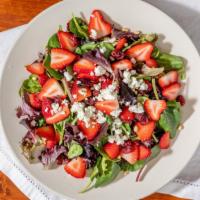 Strawberry Salad · Mixed greens topped with goat cheese. Strawberries, dried cranberries, and pine nuts. Served...