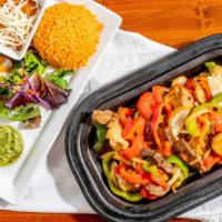 The Combo Azteca Fajitas · Steak, shrimp and marinated chicken breasts with grilled slices of onions and green peppers....