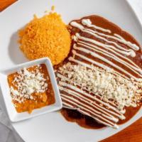 Enchiladas De Mole Dinner · Three rolled up corn tortillas stuffed with your choice of meat, topped with our delicious m...