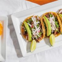 Tacos Azteca Dinner · Order of three. Outside skirt steak strip grilled to order, topped with cilantro, onions, av...