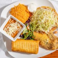Combinacion Veracruz · One chicken tostada, one ground beef chimichanga, and one cheese chile relleno. Served with ...