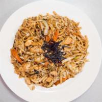 Yaki Udon · stir-fried noodle dish with chicken, cabbage, onions, scallions, carrots, seaweed flakes & s...