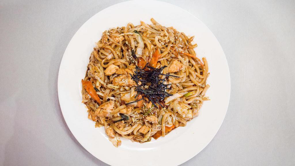 Yaki Udon · stir-fried noodle dish with chicken, cabbage, onions, scallions, carrots, seaweed flakes & sesame seeds
