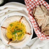 Hummus Plate · Chickpeas mixed with tahini, hint of lemon and garlic served with pita bread.