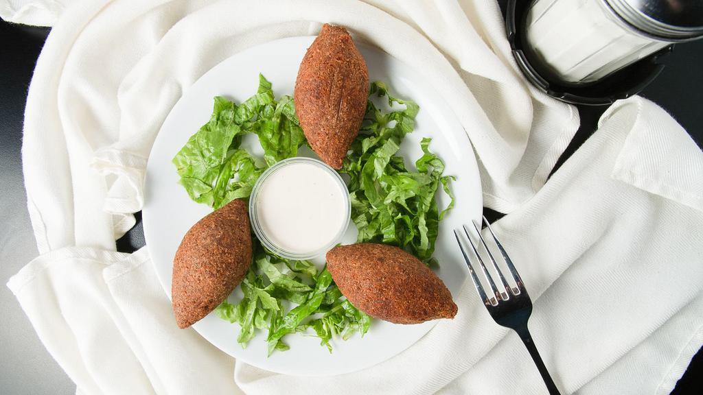 Fried Kebbeh · 3 pieces of lean beef, cracked wheat, onion, pine nuts mixed with our special kebbeh spice, fried to order, serve with tahini sauce.