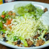Burrito Bowl · Your choice of ground beef or shredded chicken with rice, whole beans, lettuce, sour cream, ...
