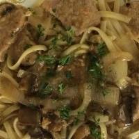 Chicken Marsala · Sauteed chicken breast with mushrooms and onions in a marsala wine sauce. Served over lingui...