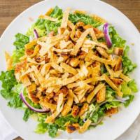 Taco Salad · Grilled Cajun chicken over lettuce, tomatoes, red onions, corn, and jalapeño pickle, sprinkl...