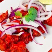 Chicken “65” Biryani · Hyderabad dum-style layered, saffron-flavored basmati rice cooked boneless chicken marinated...