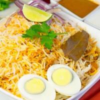 Vegetable Dum Biryani · Hyderabad dum-style layered, saffron-flavored basmati rice cooked with vegetables marinated ...
