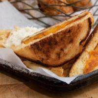 Grilled Cheese · Grilled cheese with american, swiss, pepper jack, and cheddar cheese.