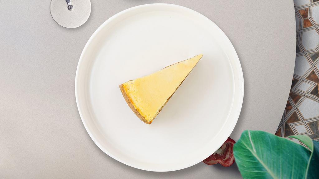 New York Cheesecake Slice · Original New York cheesecake is decadently rich in taste, but fluffy in texture. It is also distinguished by a generous amount of sour cream used in the recipe.