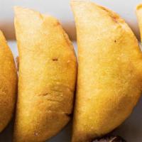 Empanada Carne · Vegetarian. Colombian fried turnovers filled with meat and potatoes.