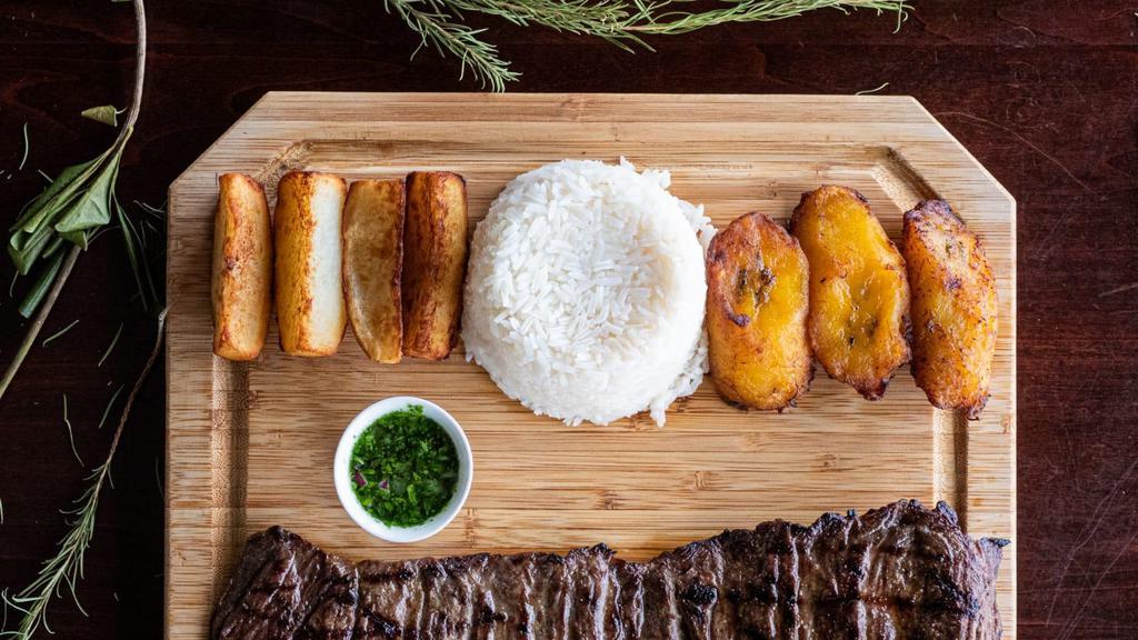 Entraña La Parrilla · Our best cut of grilled steak! Tender outer skirt with rice, potato, and sweet plantains.