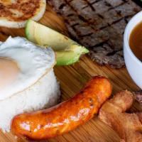Bandeja Paisa · Grilled sirloin served with rice, egg, beans, pork rind, avocado, white cornbread, Colombian...
