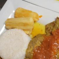 Bistec A La Criolla · Steak sautéed with onions and tomatoes and served with rice, cassava, and green plantains.