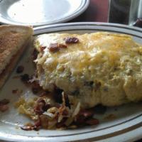 Western Omelette · Ham, cheese, onions, green peppers, and tomato. Consuming raw or undercooked meats, poultry,...