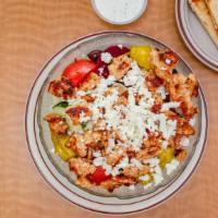 Large Chicken Greek Salad · Lettuce, cucumbers, tomato, beets, pepperoncini, olives, feta cheese and onions.
