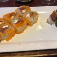 Crazy · Tuna, salmon and hamachi, covered with masago.