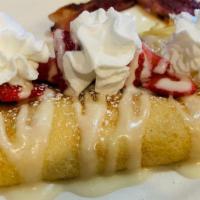Strawberry Cream Crepes · Sweet cream and fresh strawberry slices stuffed into sweet crepes. Then drizzled with sweet ...