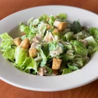 Chicken Caesar Salad · Fresh romaine topped with grilled chicken, croutons and Parmesan cheese. Tossed in our Caesa...
