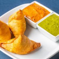 Samosa · Crispy turnovers stuffed with shredded meat (2 pieces).