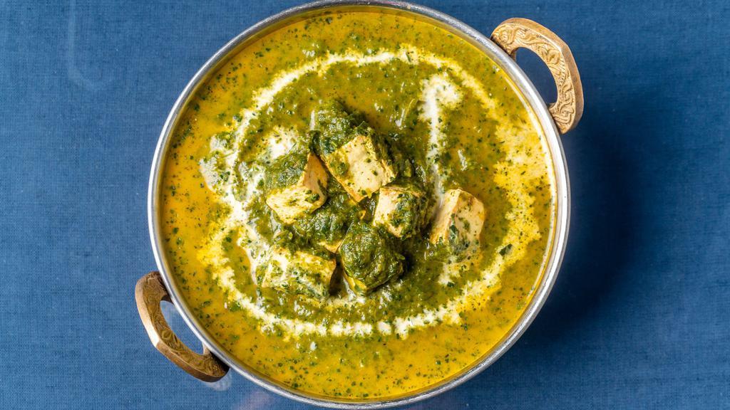 Palak Paneer · Cottage cheese and spinach cooked in authentic gravy.