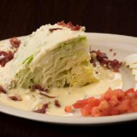 Wedge Salad · A wedge of iceberg lettuce with diced tomatoes, gorgonzola cheese, prosciutto and hard-boile...