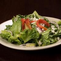 Santa Teresa Salad · Romaine lettuce, red onions, and goat cheese, tossed with a dijon vinaigrette and topped wit...