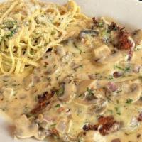 Chicken Vincenzo · Lightly breaded, crispy and topped with fontina cheese with sauteed mushrooms, garlic and on...