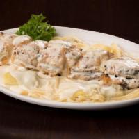 Samantha · Marinated Chicken breast rolled in Italian bread crumbs skewered and broiled.  Served over f...