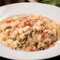 Linguine Frutti Di Mare · Clams, shrimp, scallops, tomatoes and mushrooms in a light bechamel sauce