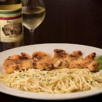 Shrimp Spiedini Maggie · Lightly breaded, skewered, grilled and topped with garlic lemon butter sauce, served with li...