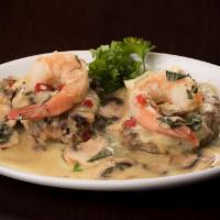 Bistecca Canzoneri · Two 4oz. beef tenderloin medallions grilled and topped with provolone, two jumbo shrimp, mus...