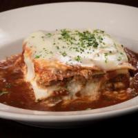 Baked Lasagna · Layered with Italian sausage, beef, ricotta cheese and Maggie's sugo, topped with provolone ...