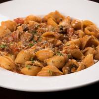 Cavatelli Catania · Sauteed mushrooms red onions, red pepper and garlic in a crushed tomato sauce topped with ro...