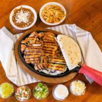 Fajitas Combo · Filling of your choice, sauteed with onions and bell peppers. Served with lettuce, sour crea...