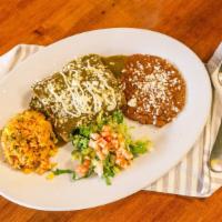 Enchiladas Suizas · Three rolled corn tortillas garnished with queso fresco and filled with your choice of sauce...