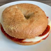 Pizza Bagel Sandwich · Bagel of choice topped with our delicious pizza sauce, cheese and your choice of topping