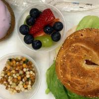 Brunch Box · Bagel Sandwich with  2 sides (fruit cup & a  bag of chips) and 1 cake donut of your choice.
