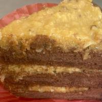 German Chocolate Cake · Three layers of chocolate cake filled with icing of caramel, coconut, and pecans and sided w...