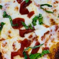 Large Margherita Pizza  · Big Kel's Marinara, Fresh Basil, Tomatoes, Fresh Mozzarella Cheese and Pizza Cheese

+Try it...
