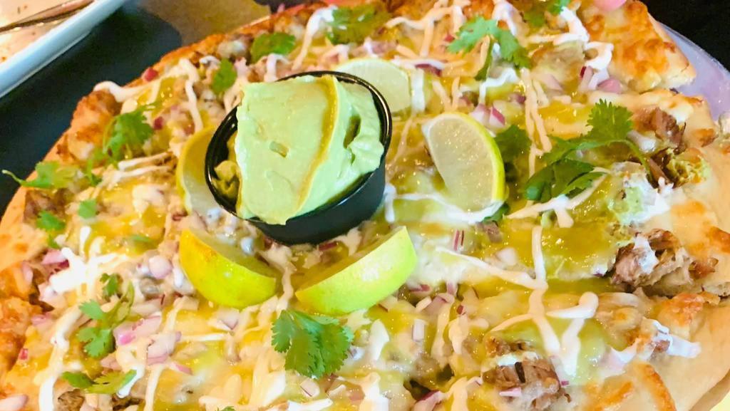 Small Street Taco Pizza · Slow Cooked Carnitas, Hugo's Taco Salsa, Asadero Cheese, Diced Red Onions, Cilantro and Guacamole.