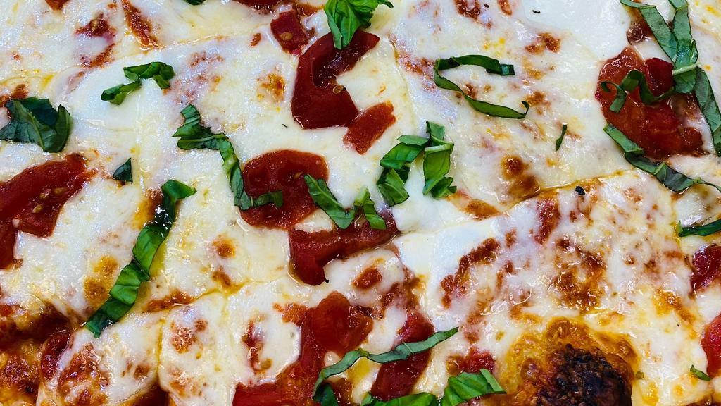 Medium Margherita Pizza  · Big Kel's Marinara, Fresh Basil, Tomatoes, Fresh Mozzarella Cheese and Pizza Cheese 

+Try it with Roasted Pulled Chicken