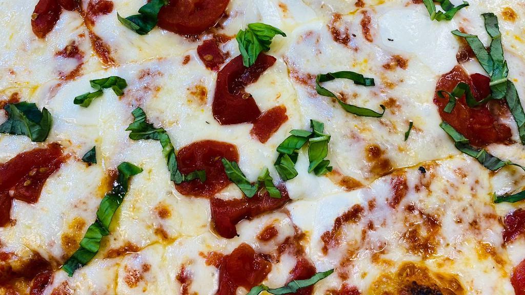 Small Margarita Pizza · Big Kel's Marinara, Fresh Basil, Tomatoes, Fresh Mozzarella Cheese and Pizza Cheese.

+Try it with Roasted Pulled Chicken