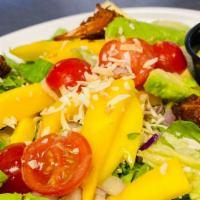 Mango Coconut Shrimp Salad · Lettuce mix mango, dry cranberries, toasted coconut, red onions, avocado, tomato, and mango ...