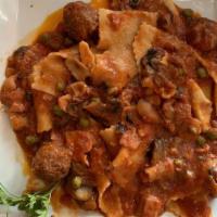 Pappardelle Tre Bacon 
 · Signature. Special ribbon pasta with parmesan Prosciutto, Meatball, Bacon, Peas, Mushrooms, ...