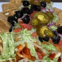 Chico Fino Wet Burrito · A giant burrito with seasoned ground beef, refried beans, onions, tomatoes, lettuce, olives,...