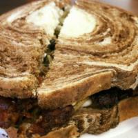 The Cuban Reuben · Contains ~ Ham, pulled pork , sauerkraut , swiss cheese , pickles. Served on a marble rye ho...